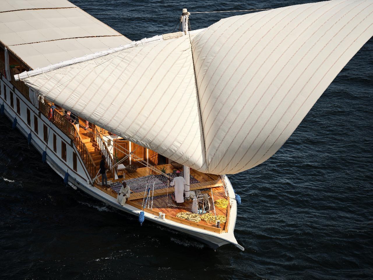 Dahabiya sails from above, catching the light
