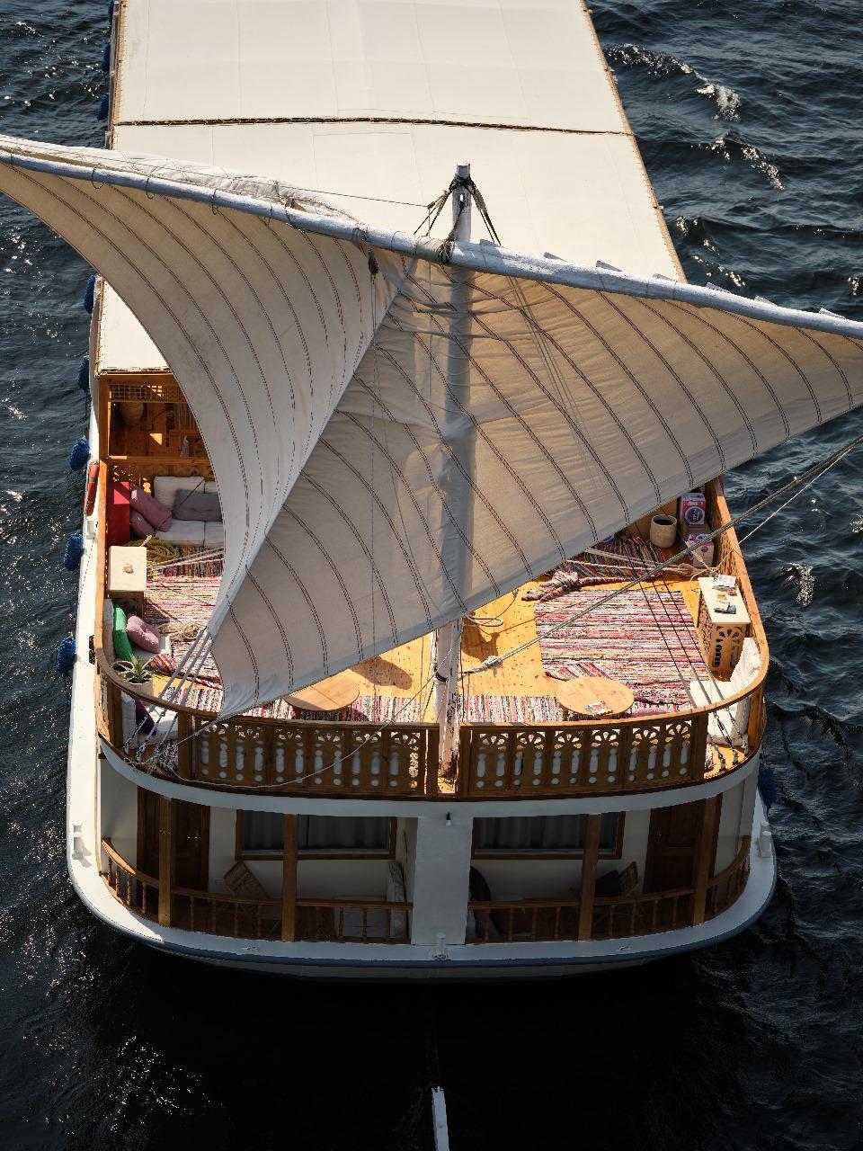 Deck from above, sails and river beneath